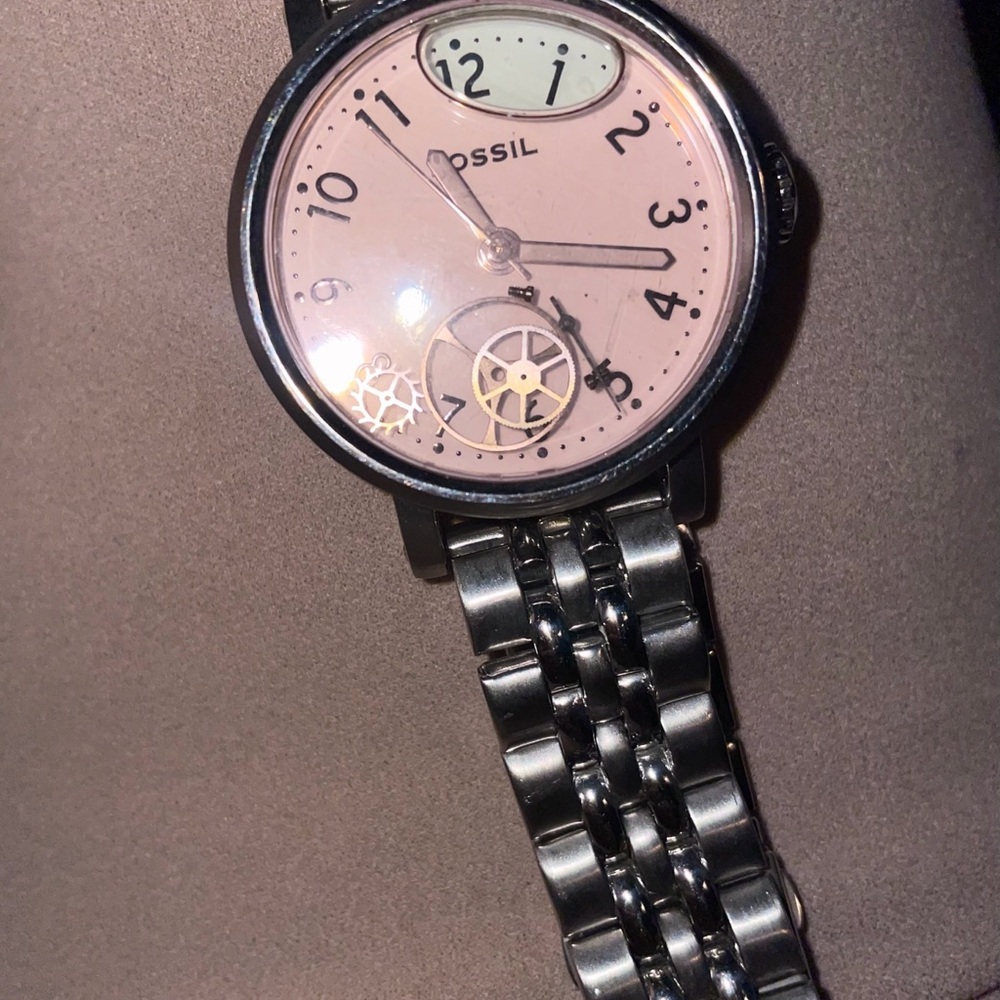 Unisex Fossil Stainless Steel designer Watch with Blush color floating gears.